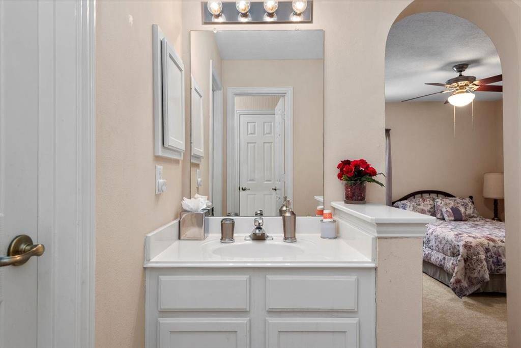 Upstairs bath opens to fourth bedroom and hallway.