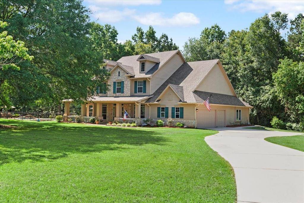Large driveway with extra parking spot. 3-car oversized garage.
