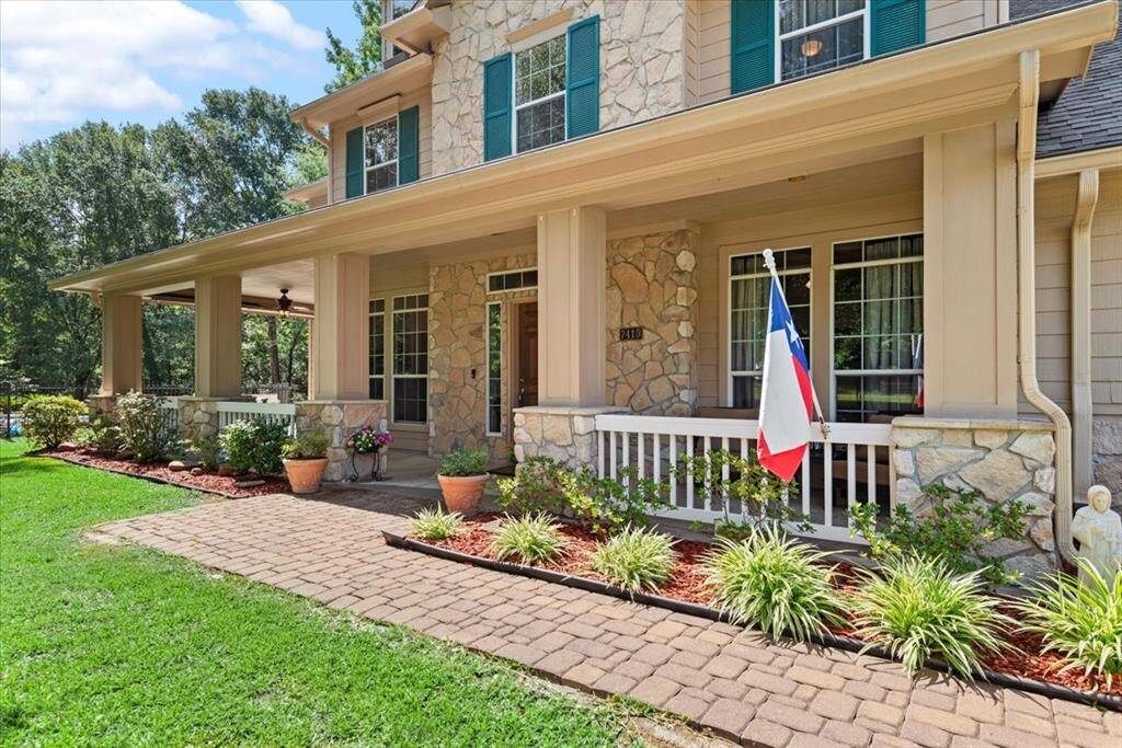 Beautiful brick walkway leads up to front porch.