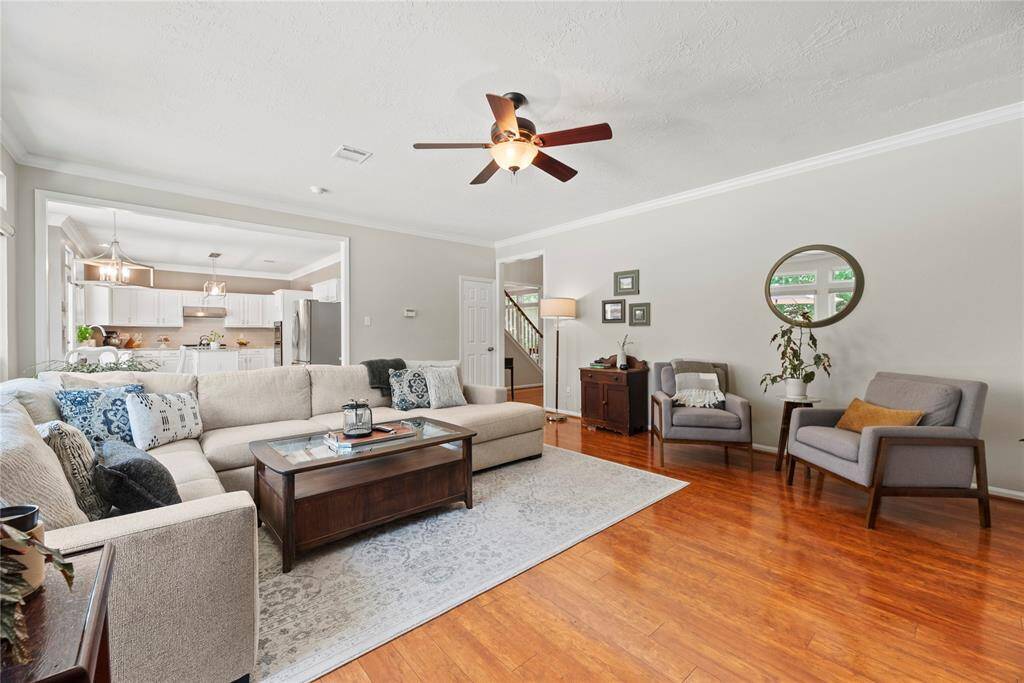 The open-concept living area flows seamlessly into the bright breakfast nook and thoughtfully designed kitchen, creating an inviting space perfect for everyday living and effortless entertaining.