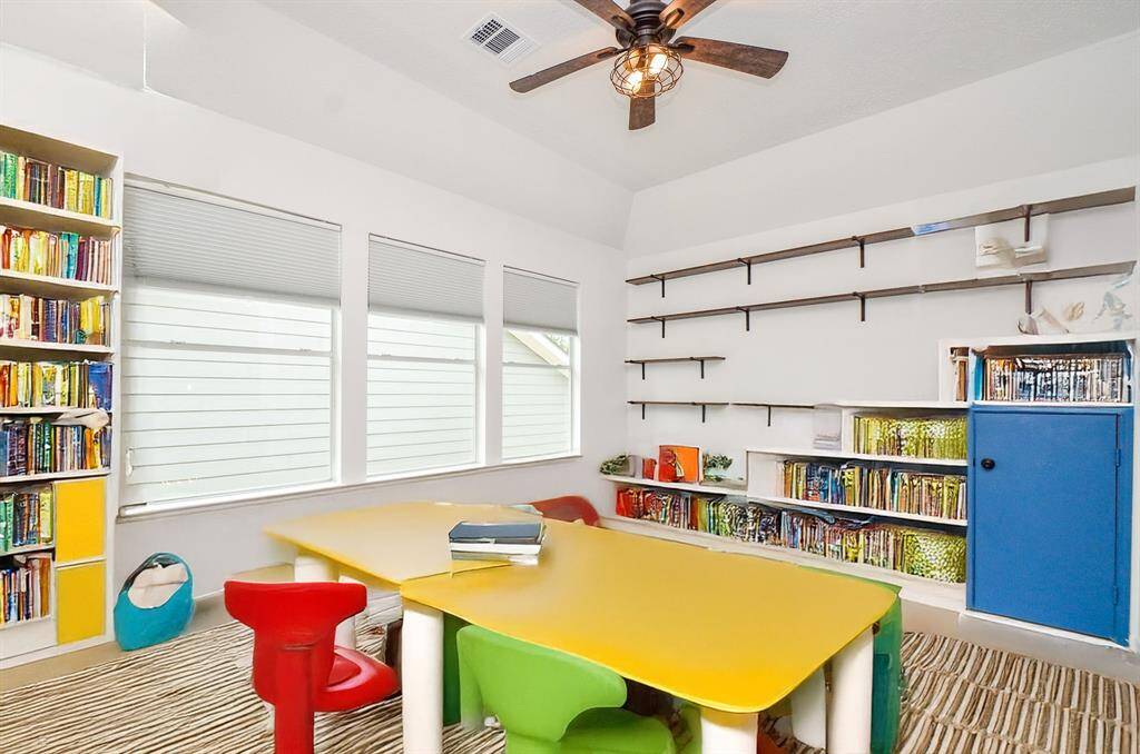 Bonus room or game room at the top of the stairs.