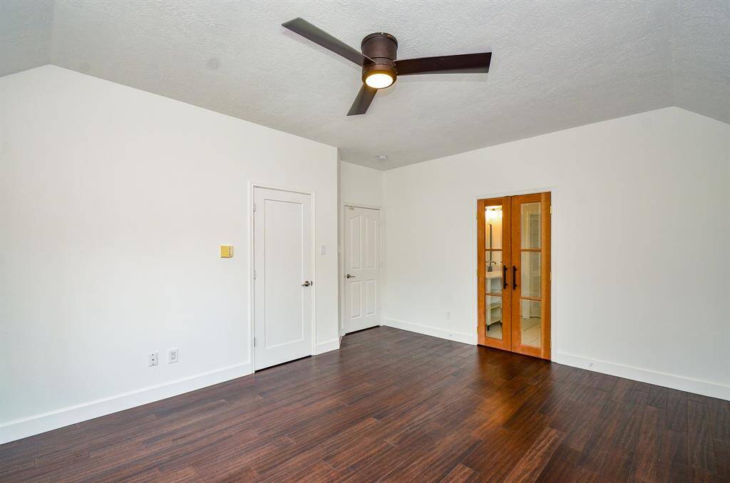 Primary bedroom with nice window seat.