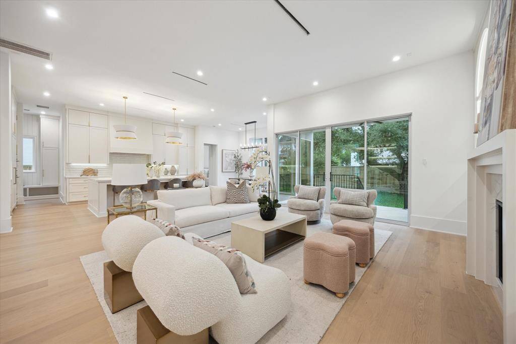 Designed for both comfort and connection, this inviting space seamlessly blends modern sophistication with timeless charm