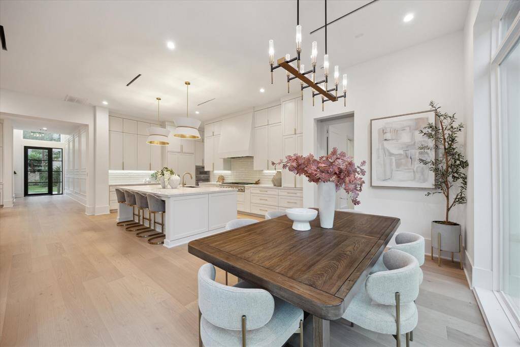 Sits conveniently adjacent to the kitchen, creating a seamless flow for casual dining and effortless entertaining