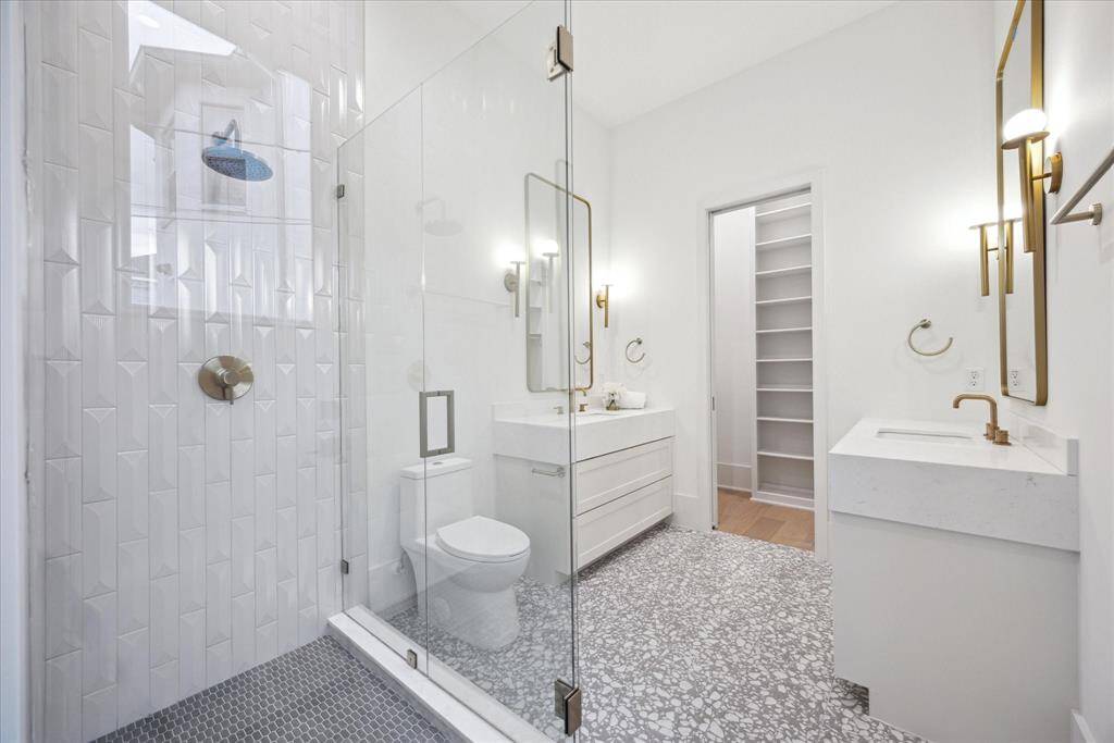[1ST FLR EN-SUITE BATHROOM] The first-floor guest en suite bathroom is beautifully appointed with a spacious walk-in shower, sleek fixtures, and elegant finishes—offering comfort and style in true French contemporary fashion