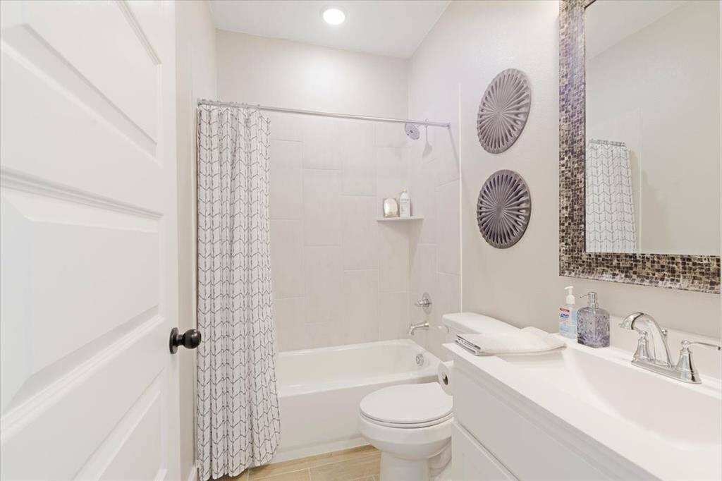 Full bathroom downstairs just outside the downstairs guest bedroom.