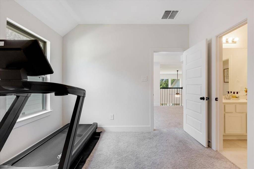 This guest bedroom, located just off the game room, includes direct access to a full bathroom.
