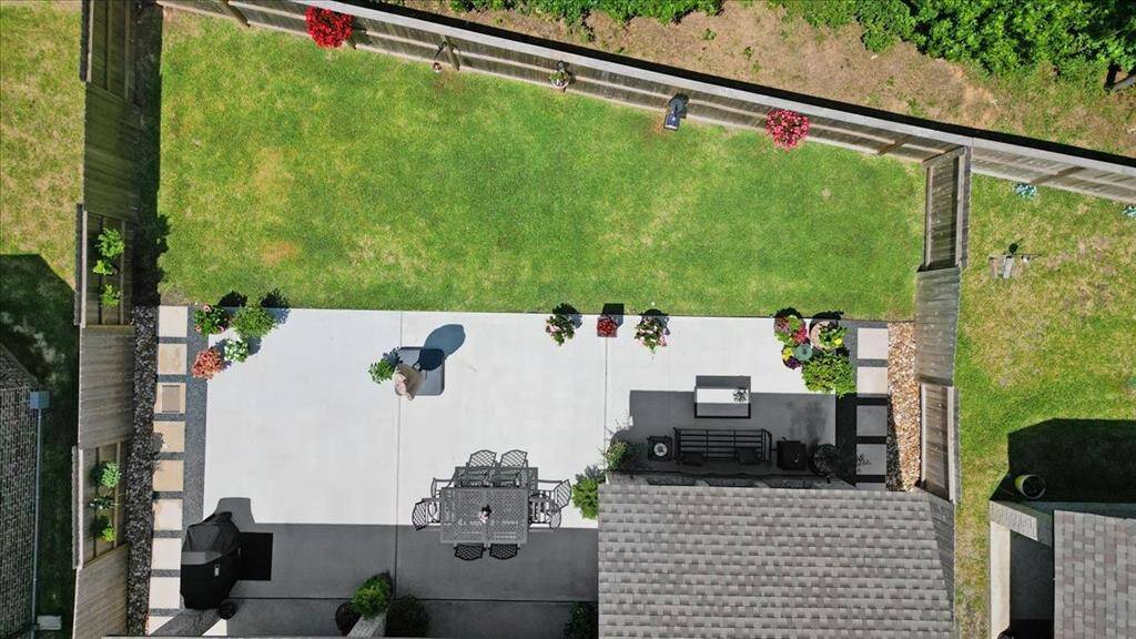 Drone view of the spacious backyard with no back neighbors.