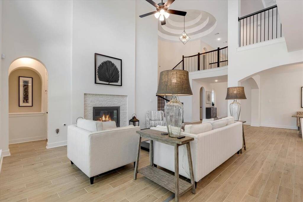 A stunning architectural feature, the stairwell ceiling rises above with dramatic lines and unique angles, adding visual interest and a custom feel.
