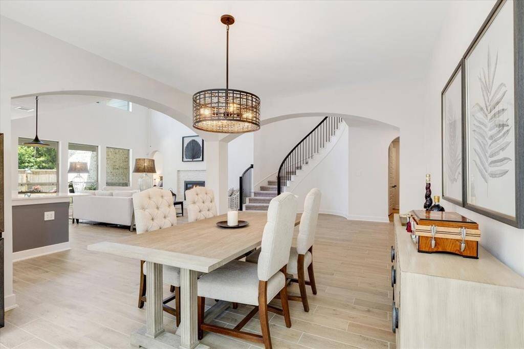 The formal dining room is spacious and elegantly designed, offering plenty of room for gatherings and special occasions.