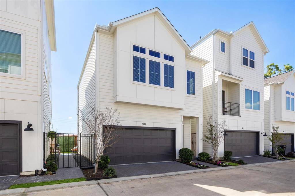 Two story home fenced with no shared walls, two car garage, additional parking on gated street.