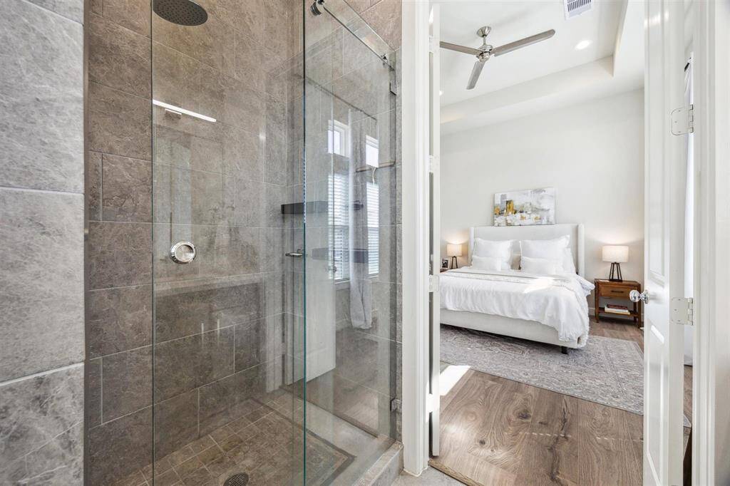 Master bath with separate walk in shower, freestanding tub and double vanity.