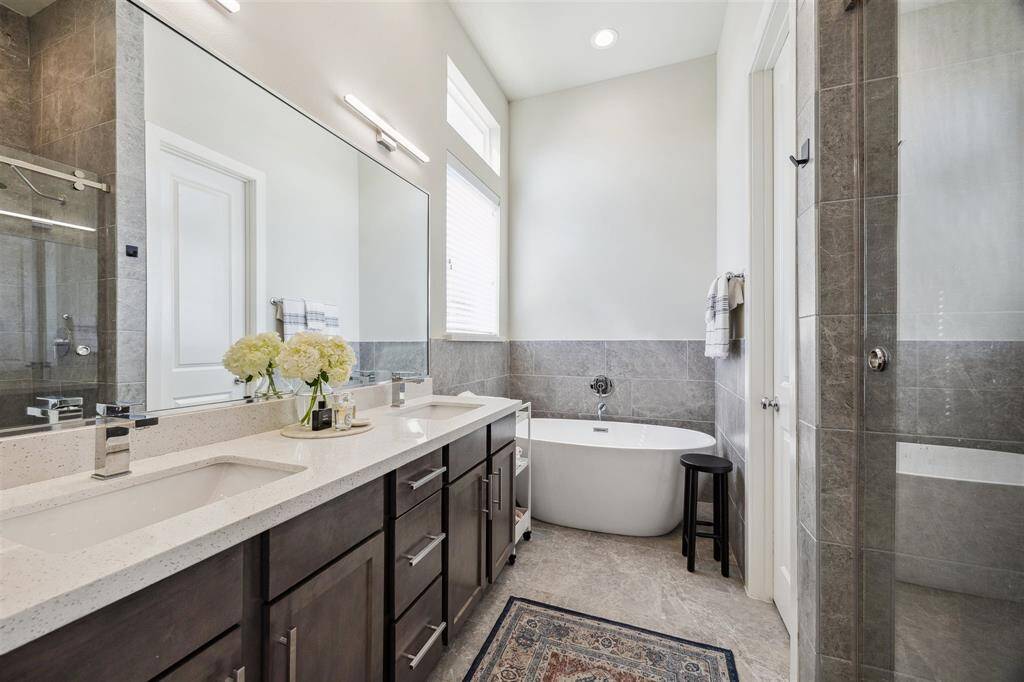 Spacious vanity with double sinks, plenty of storage and natural light.