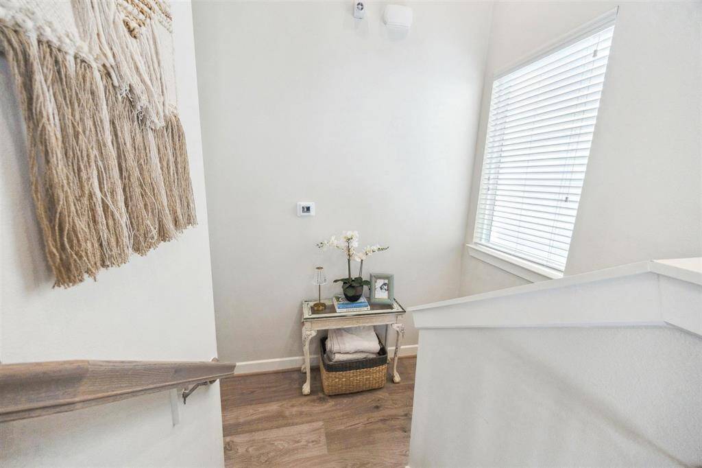 Landing between first and second floor with split level access to master suite.
