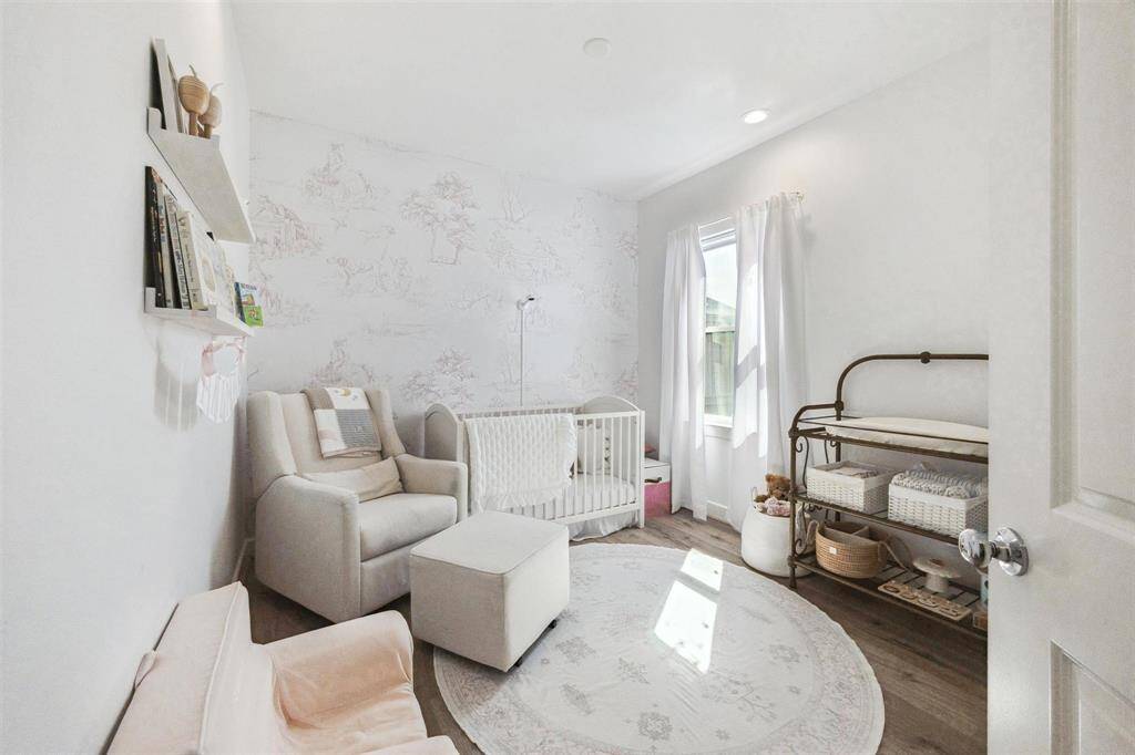 First floor secondary bedroom with view of the backyard