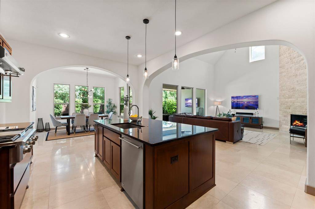 Large Windows Line The Living Space Providing Gorgeous Views of Your Backyard Oasis and Plenty of Natural Light