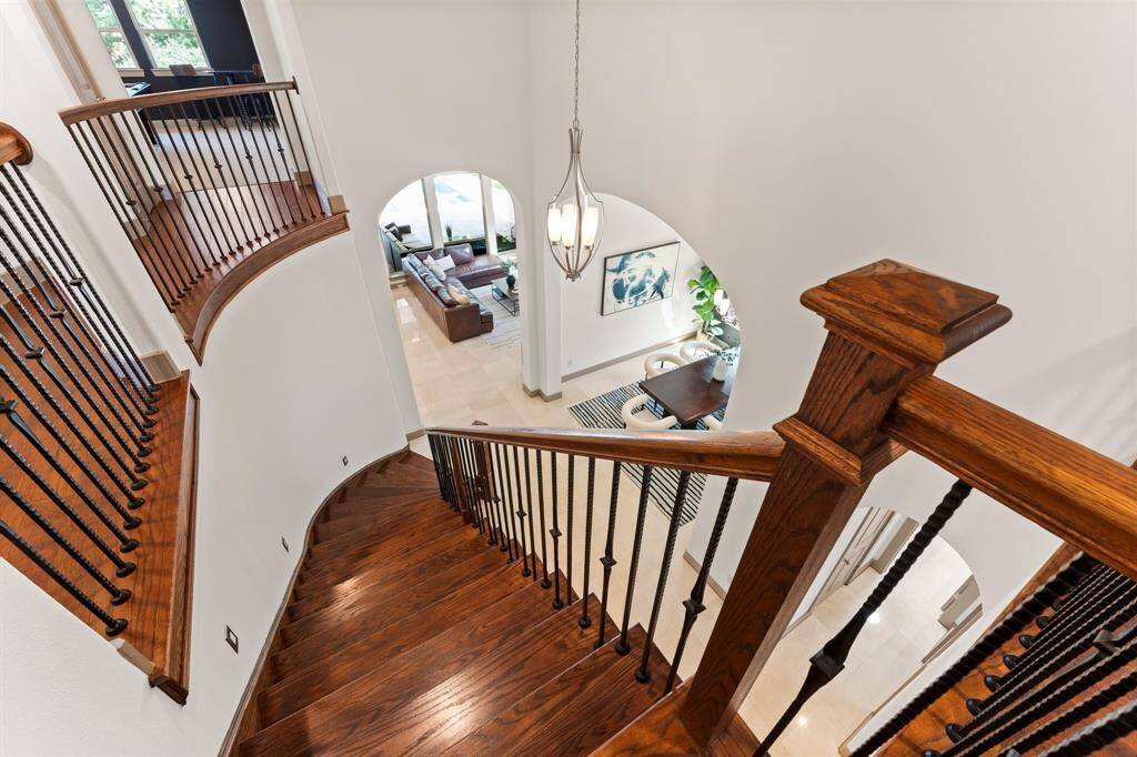 Sweeping Staircase Leading to 3 Additional Bedrooms Upstairs, Media room and Gameroom