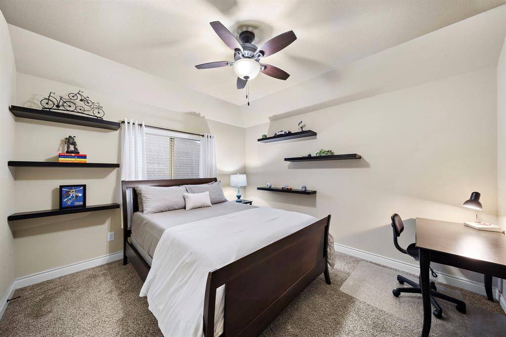 Well-proportioned and tucked away from high-traffic areas, this bedroom offers calm and comfort with a tailored layout that supports daily living.