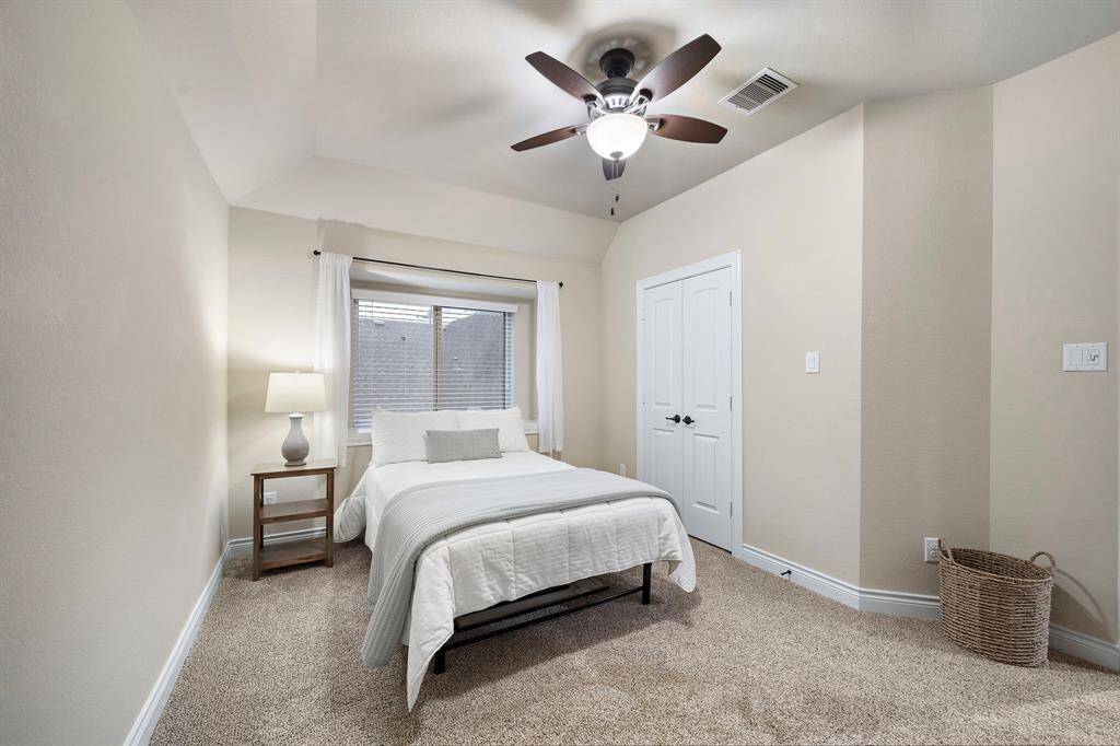 This bedroom is designed with clean lines and functional spacing, allowing flexibility for evolving household needs.