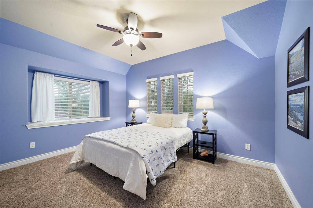 Set within the home’s upper level, this bedroom offers a clean layout with materials and finish quality consistent with the rest of the property.
