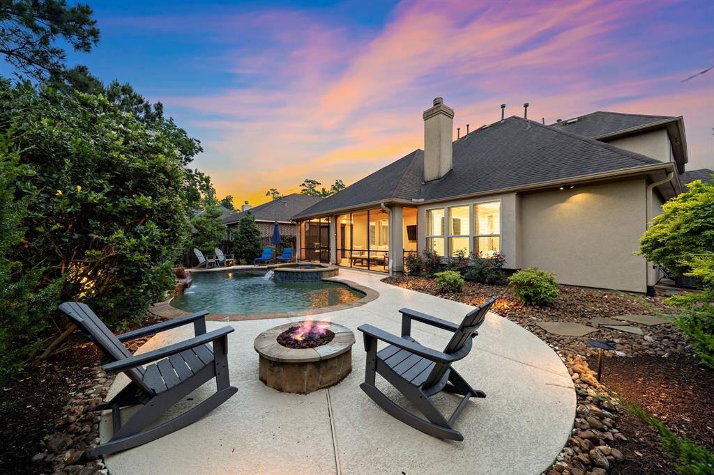 Designed for both relaxation and functionality, the fire pit lounge is nestled alongside privacy landscaping, while a hidden dog run offers added convenience for pet lovers.