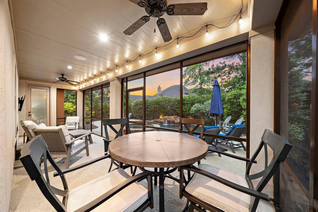 Completed in 2023, the screened-in patio offers unobstructed indoor-outdoor flow, allowing movement between the home and pool area in a fully enclosed setting.
