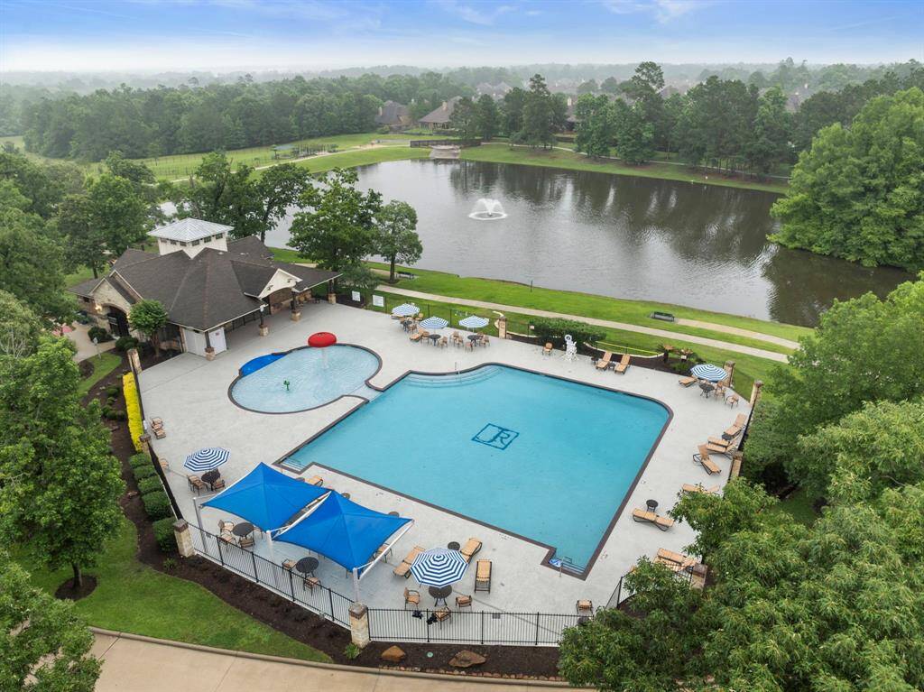 Amenity-rich neighborhood features a resort-style clubhouse with poolside seating, a spacious community pool, shaded cabanas, and scenic lake views with walking trails. Enjoy relaxing by the water fountain, picnicking under umbrellas, or taking advantage of nearby recreational spaces and walking paths.