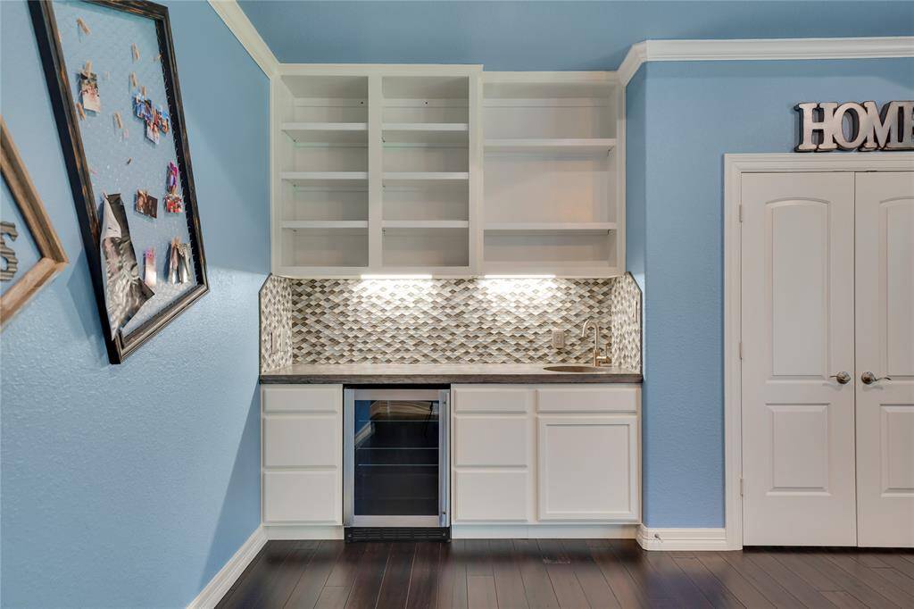 Wet bar with wine fridge & game closet