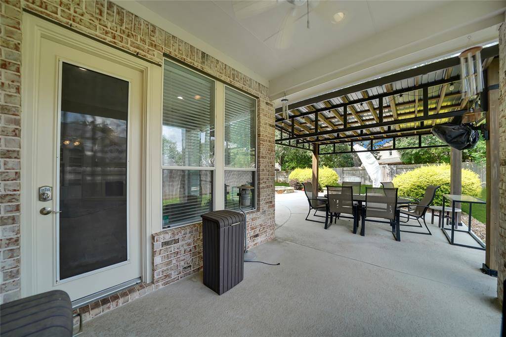 Cedar arbor over extended patio with fan
