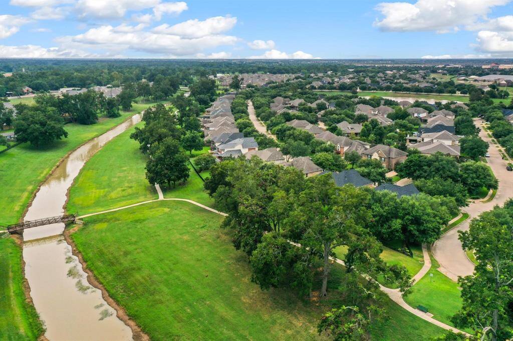 Aerial view of the bayou...low , low tax rate, great schools & more make this a beautiful choice!  More professional photographs coming soon!