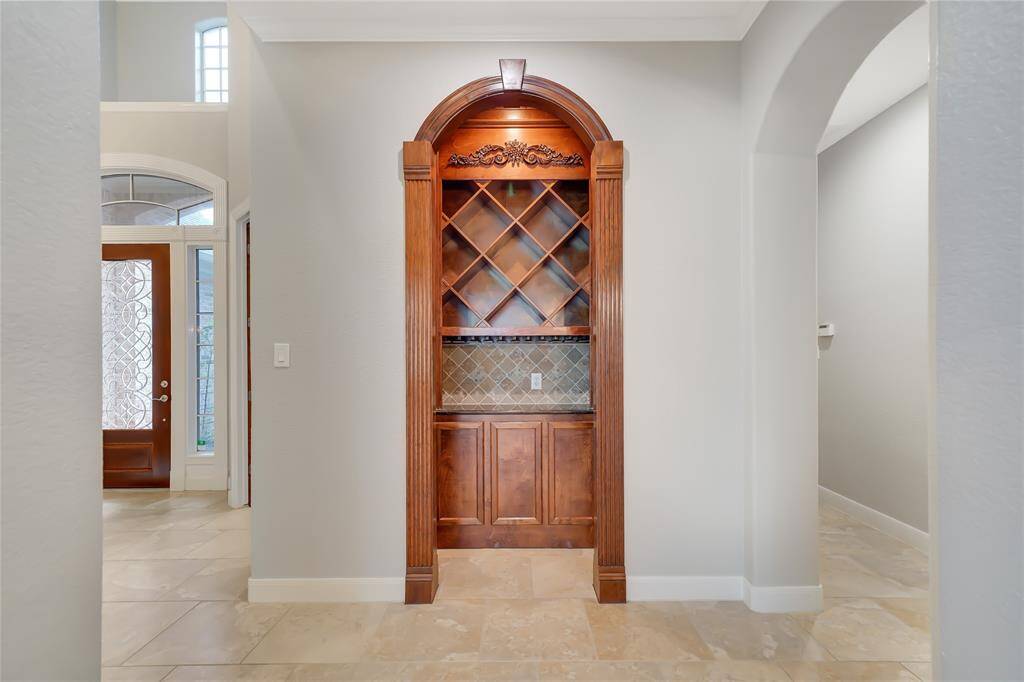 Custom built-in wine grotto with intricate detailing.