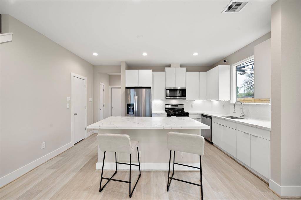 Ultra-modern cabinets to perfectly complement the Quartz countertops. You really need to come and see it for yourself.