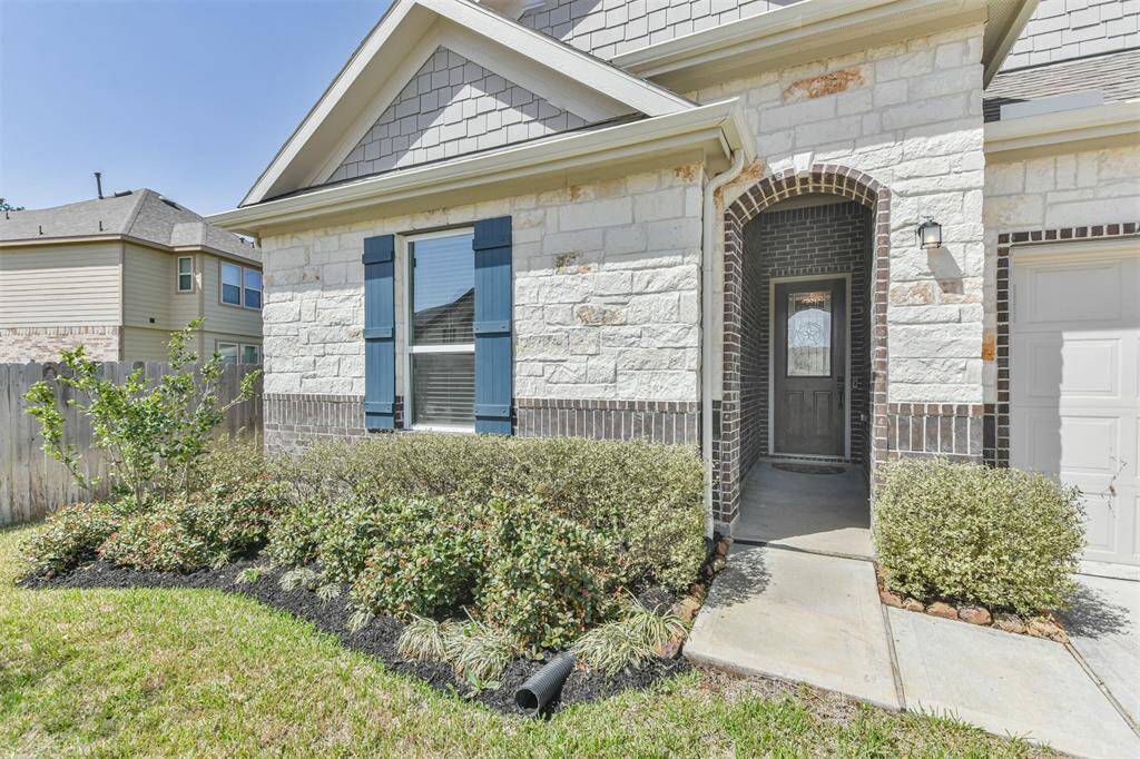 The house has an inviting walkway and is set in a well-maintained neighborhood.