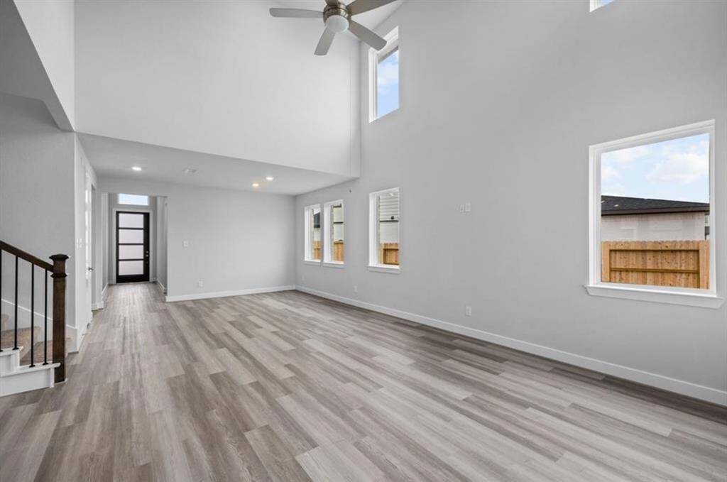 Experience the expansive feel of the open-concept family room, complete with high ceilings and abundant natural light, as you enter this stunning home.