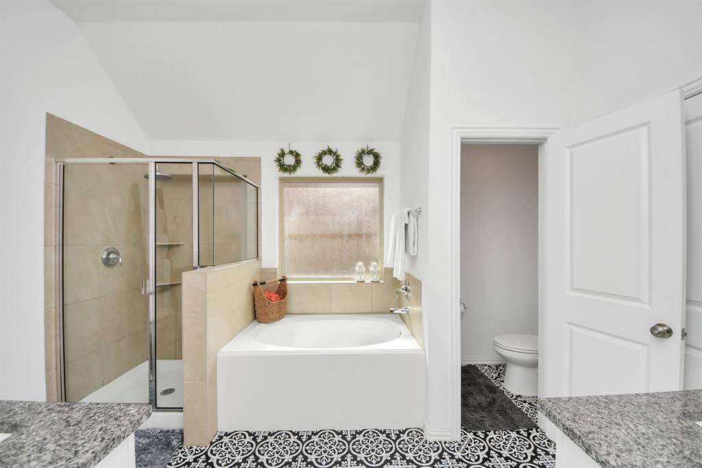 Your spa-like primary en suite bathroom awaits!