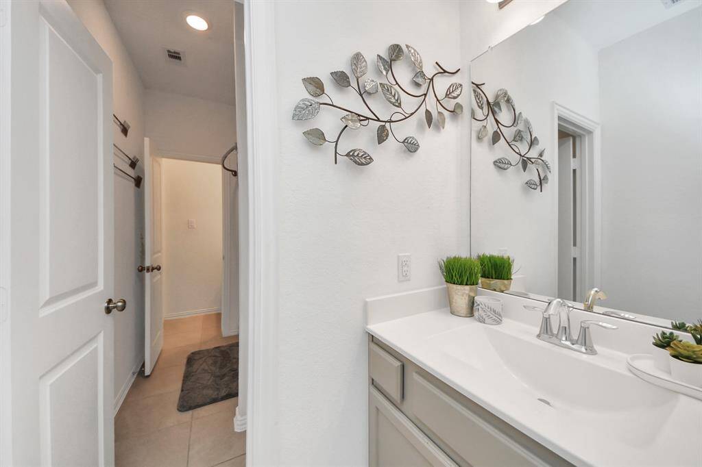Other end of the Jack and Jill bath that connects to the hallway.