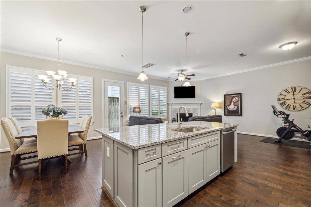 From morning coffee to evening gatherings, this open kitchen flows effortlessly into the dining and living areas—anchoring the home with style and ease.