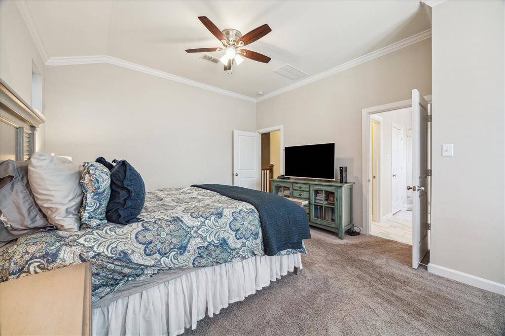With direct access to the en-suite bath, this generous primary bedroom offers comfort, space, and a layout perfect for rest and relaxation.