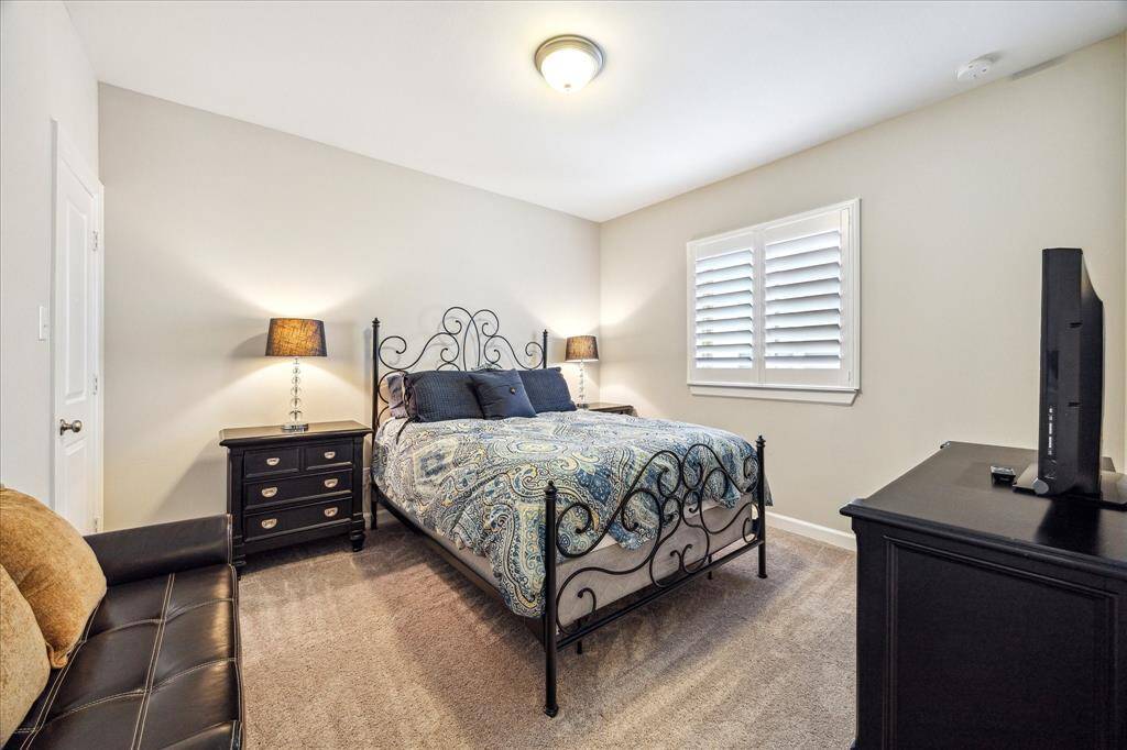 Spacious and inviting, this secondary bedroom features a large window, generous closet, and plenty of room to relax or work from home.