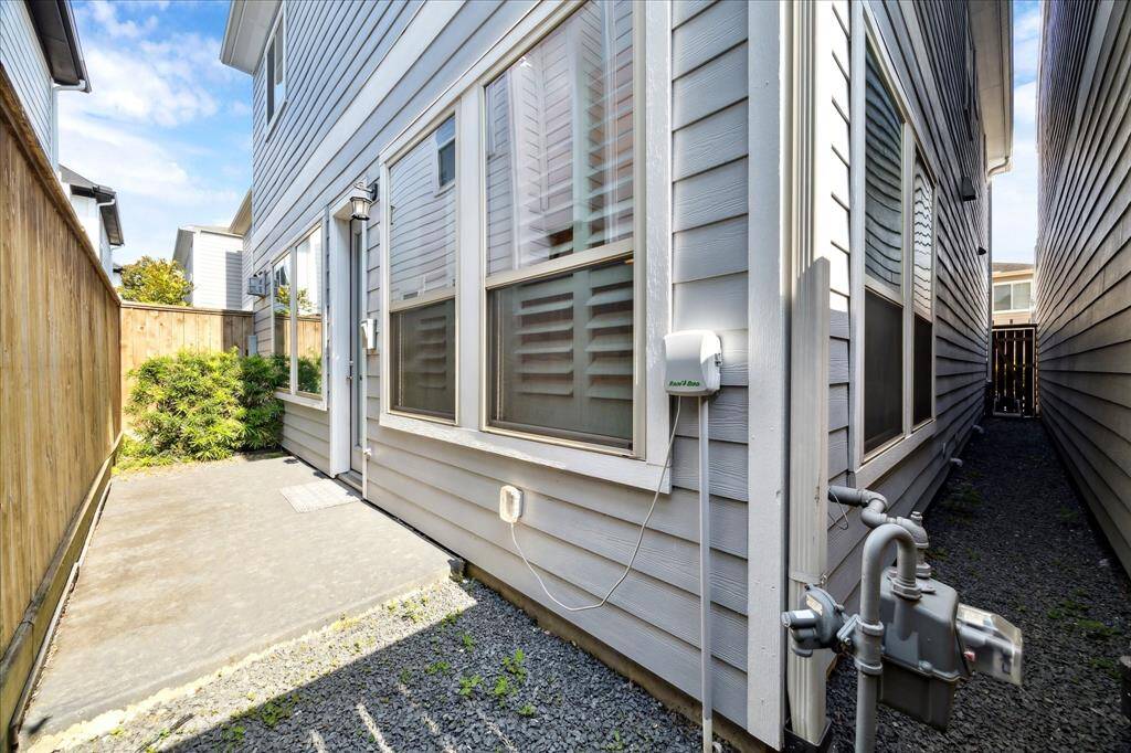 Low-maintenance backyard with private patio—perfect for grilling, a container garden, or simply relaxing in your own outdoor space.