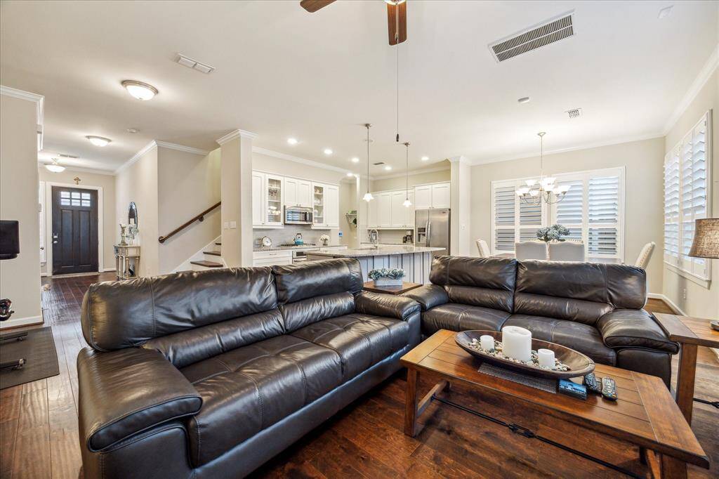 The heart of the home—this airy living room is perfectly positioned between the chef’s kitchen and dining space, ideal for entertaining or everyday living.