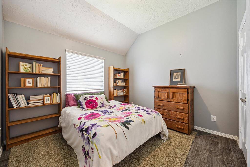 Another well-sized secondary bedroom with high ceilings and a peaceful ambiance.