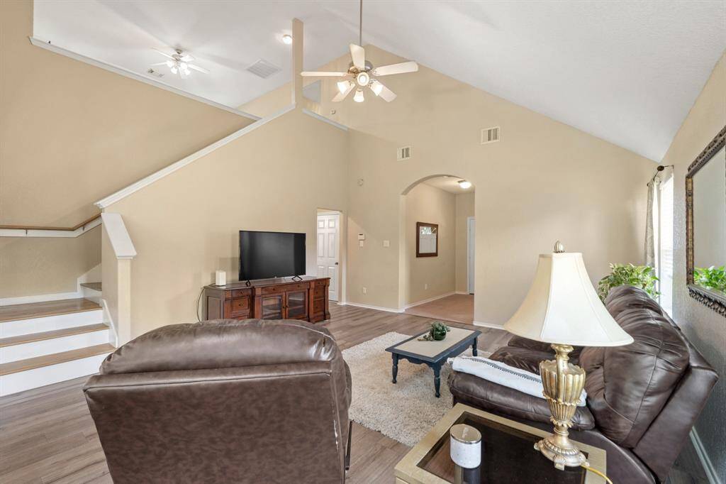 A staircase leads to an upper level, enhancing the spacious feel.