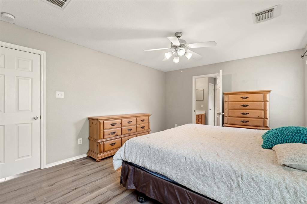 Primary bath is located just off the bedroom, perfect for convenience and privacy.