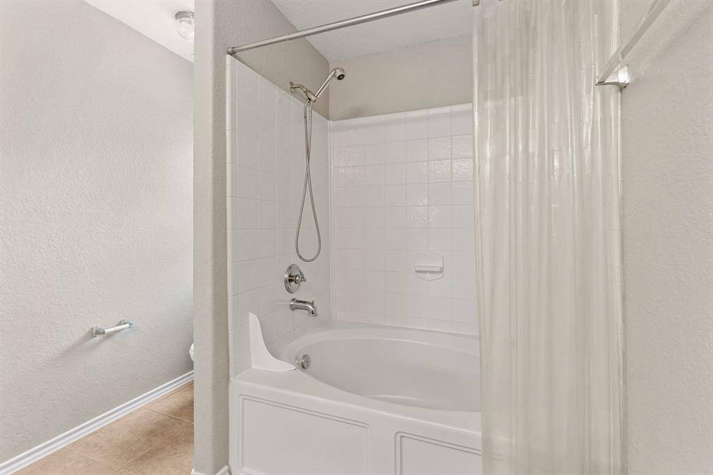 Garden tub in the primary bath creates a perfect spot for relaxation.