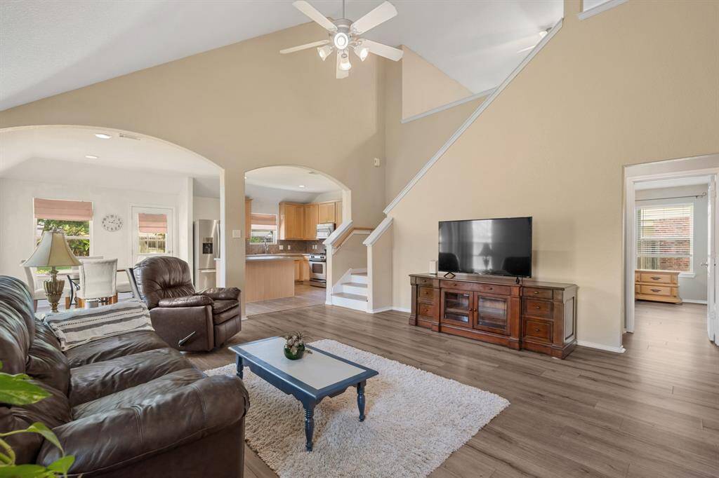 Spacious living are features an open layout, seamlessly connecting to the kitchen and dining space.