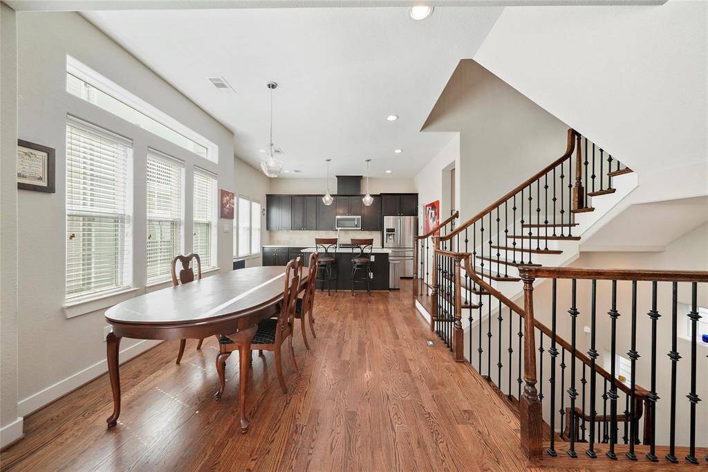 Staged.  Dining room looking towards the island kitchen.