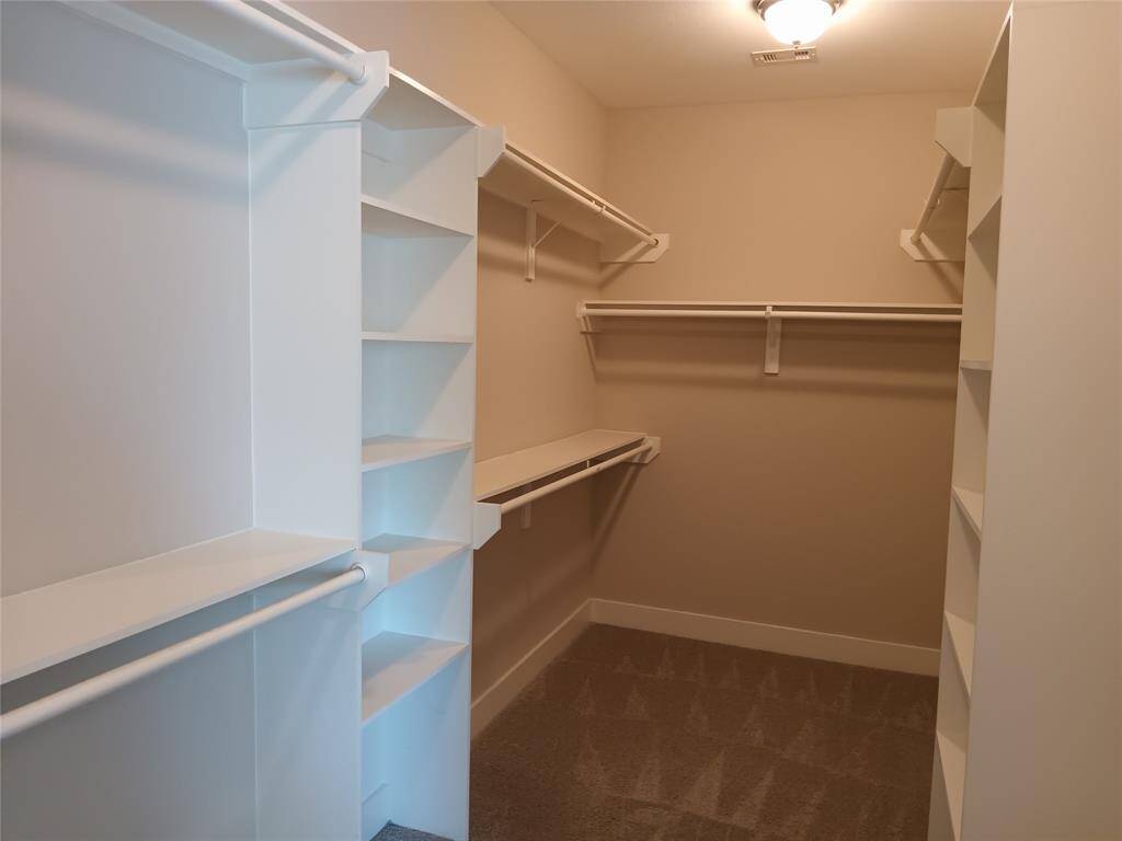 Primary walk-in closet is 16 feet long by 6 feet wide.  This closet is big enough!