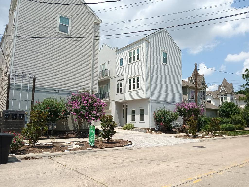 Driveway to your new home.  You will enjoy strolling the neighborhood on the sidewalk.  This wide curb and gutter street allows for plenty of street parking!
