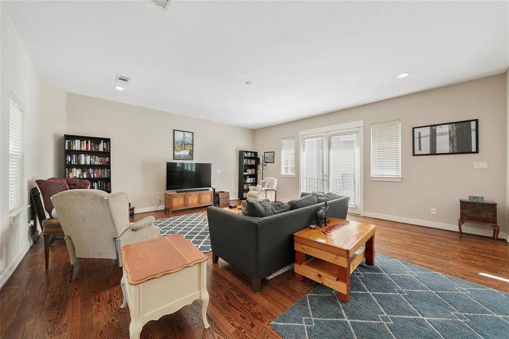 Staged.  Another photo of the spacious living room.  How will you lay your furniture out?